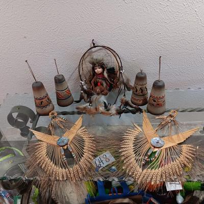 4 CLAY BELLS, PORCELAIN DOLL IN A SWING LIKE AND 2 STRAW & WHEAT ART PIECES