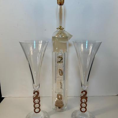 Lot 133. "2000" Decorative bottle & glasses