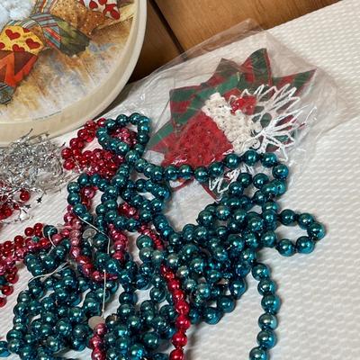 Lot 746 Tin of mercury glass garland