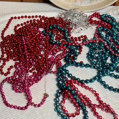 Lot 746 Tin of mercury glass garland