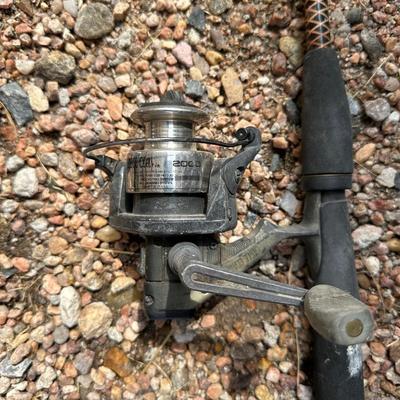 4 FISHING POLES WITH REELS