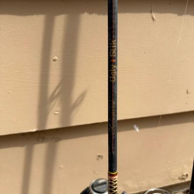 4 FISHING POLES WITH REELS
