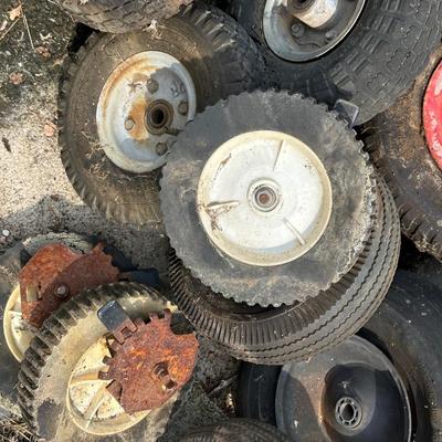 A PILE OF SMALL TIRES (WHEELBARROW, DOLLY, ETC)