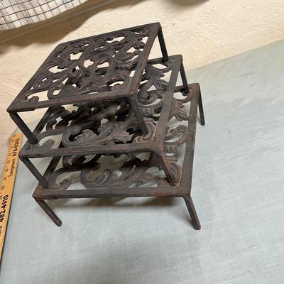 Lot 870 Cast iron trivets