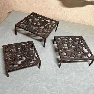 Lot 870 Cast iron trivets