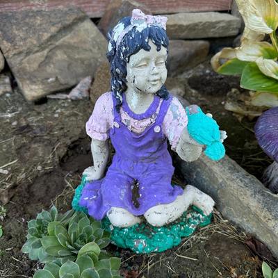 CONCRETE MUSHROOMS AND A LITTLE GIRL YARD ART