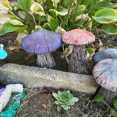 CONCRETE MUSHROOMS AND A LITTLE GIRL YARD ART
