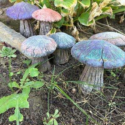 CONCRETE MUSHROOMS AND A LITTLE GIRL YARD ART
