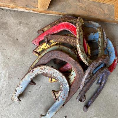 A COLLECTION OF HORSE SHOES