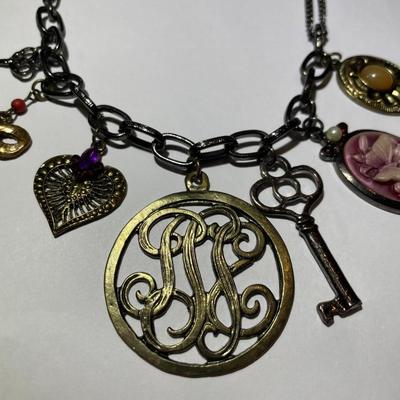 Vintage "Kissaka" Fashion Charm Necklace 17-20" Adjustable in Very Good Preowned Condition.