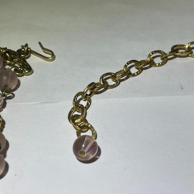 Vintage Preowned Gold-tone Triple Strand Pinkish Glass Bead Fashion Necklace 16-19" Adjustable in Very Good Preowned Condition.