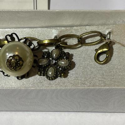 Vintage Mid-Century Antiqued Brass Charm Bracelet by Decade with Miscellaneous Charms as Pictured.