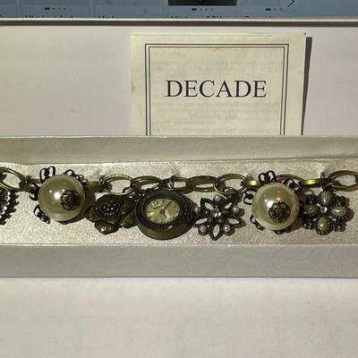 Vintage Mid-Century Antiqued Brass Charm Bracelet by Decade with Miscellaneous Charms as Pictured.