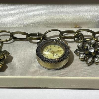Vintage Mid-Century Antiqued Brass Charm Bracelet by Decade with Miscellaneous Charms as Pictured.