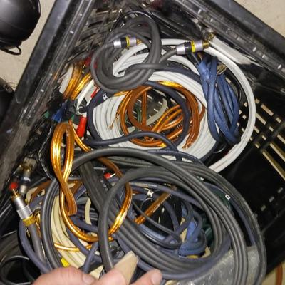 A BASKET FULL OF SPEAKER AND OTHER ELECTRONIC CORDS