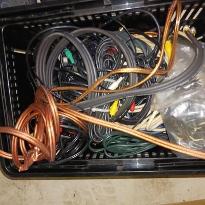 A BASKET FULL OF SPEAKER AND OTHER ELECTRONIC CORDS