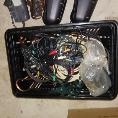 A BASKET FULL OF SPEAKER AND OTHER ELECTRONIC CORDS