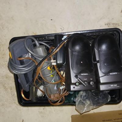 A BASKET FULL OF SPEAKER AND OTHER ELECTRONIC CORDS