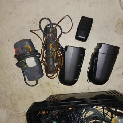 A BASKET FULL OF SPEAKER AND OTHER ELECTRONIC CORDS