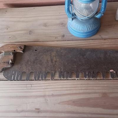 2 MAN SAW, DUBL HANDI WASHBOARD AND AN OLD LANTERN