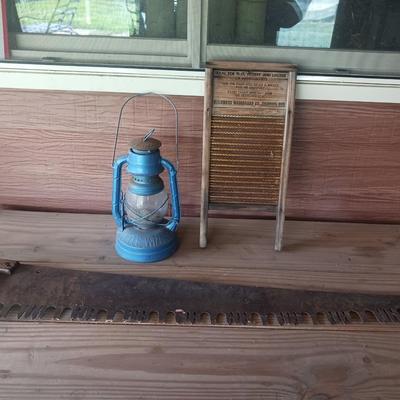 2 MAN SAW, DUBL HANDI WASHBOARD AND AN OLD LANTERN