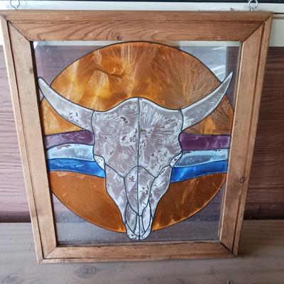 A SMALL CHILD'S SADDLE AND A STAINED GLASS STEER