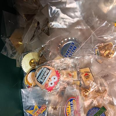MANY NEW SAFETY PINS MAINLY FROM PIZZA HUT