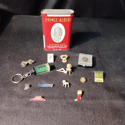 PRINCE ALBERT TIN, VARIOUS PINS AND A KEYCHAIN