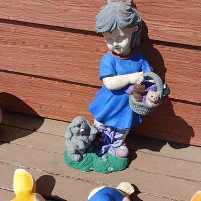 GARDEN CONCRETE BIRDS AND A LITTLE GIRL