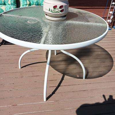GLASS TOP PATIO TABLE AND A FLOWER POT