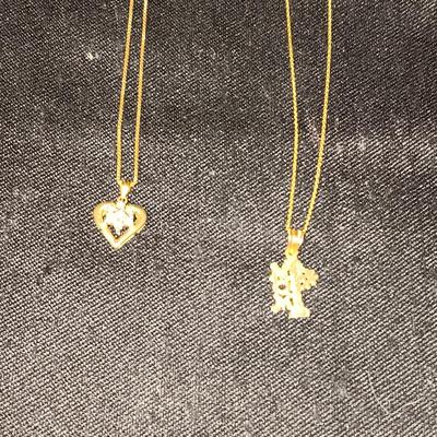 TWO 14K CHAINS AND TWO 10K PENDANTS