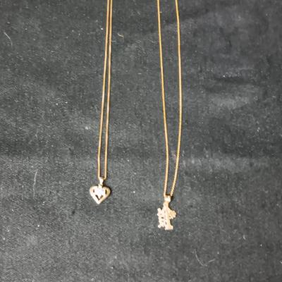 TWO 14K CHAINS AND TWO 10K PENDANTS