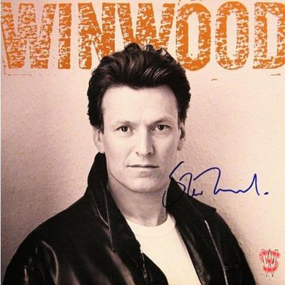 Steve Winwood signed "Roll With It" album 