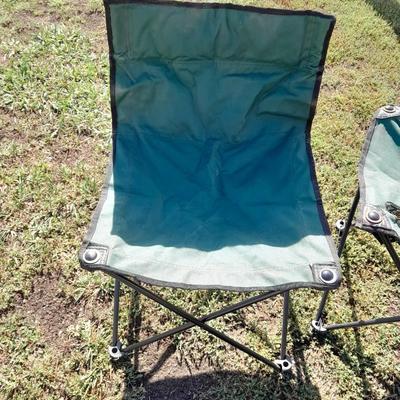 Two folding camp chairs and a folding table with drink holders