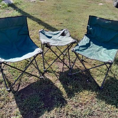 Two folding camp chairs and a folding table with drink holders