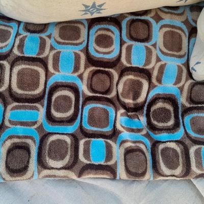 Large sized throw pillows with zippers and a soft lap blanket