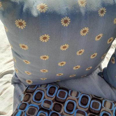 Large sized throw pillows with zippers and a soft lap blanket
