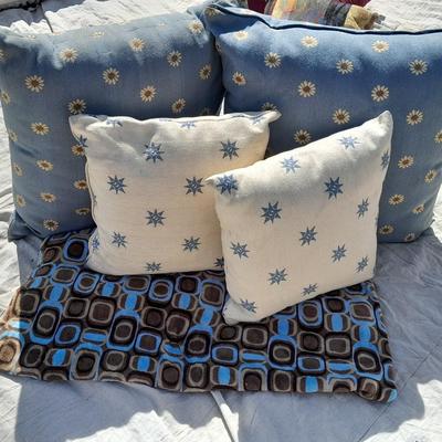 Large sized throw pillows with zippers and a soft lap blanket