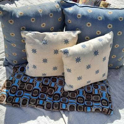 Large sized throw pillows with zippers and a soft lap blanket