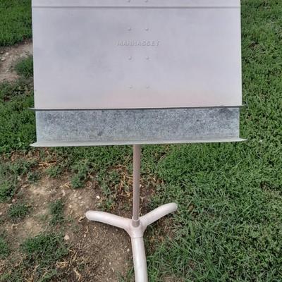 Adjustable music stand with Sheet music and music books for different instruments