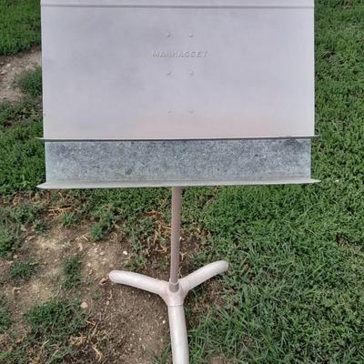 Adjustable music stand with Sheet music and music books for different instruments