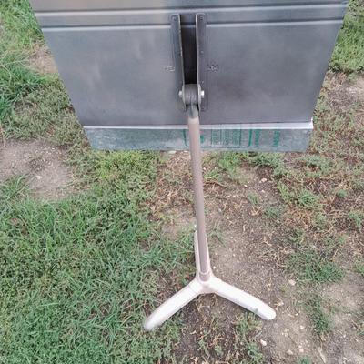 Adjustable music stand with Sheet music and music books for different instruments