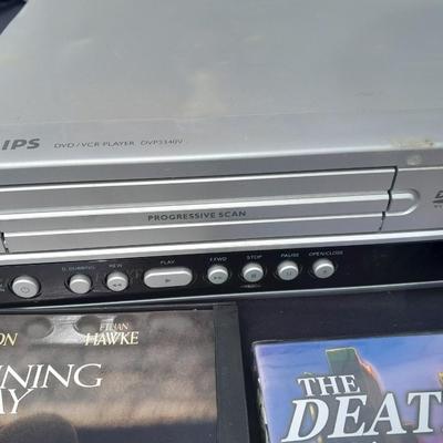 Philips DVD /VHS player with an assortment of DVDS