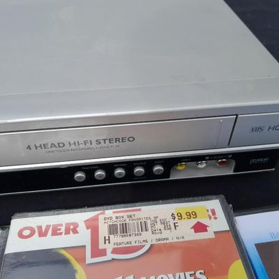 Philips DVD /VHS player with an assortment of DVDS