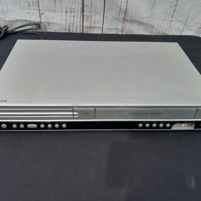 Philips DVD /VHS player with an assortment of DVDS