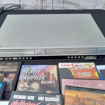 Philips DVD /VHS player with an assortment of DVDS