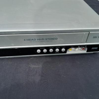 Philips DVD /VHS player with an assortment of DVDS