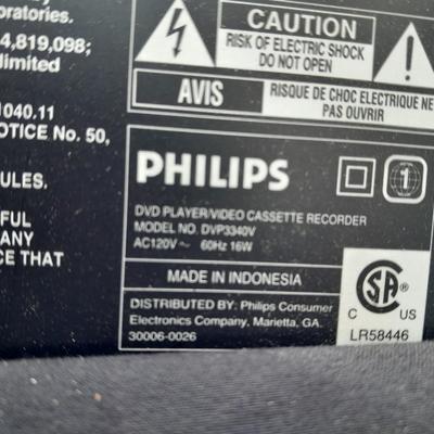 Philips DVD /VHS player with an assortment of DVDS