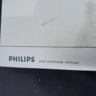 Philips DVD /VHS player with an assortment of DVDS