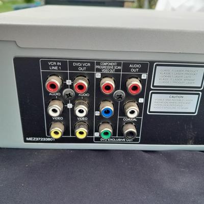 Philips DVD /VHS player with an assortment of DVDS